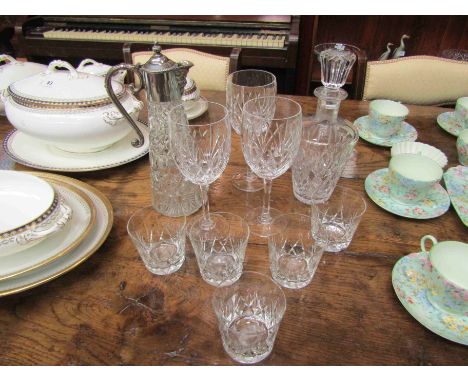 A claret jug, decanter, large wine glasses and tumblers