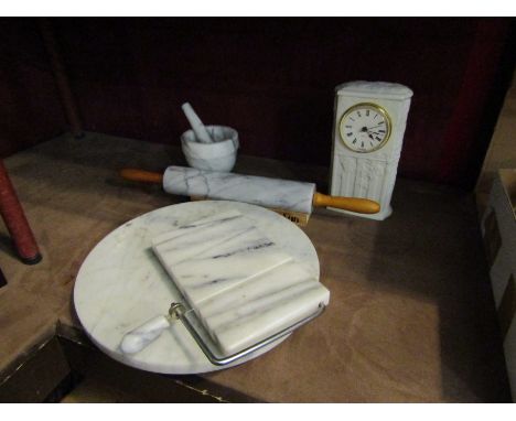 A marble cheese board, rolling pin, mortar and miniature dresser etc