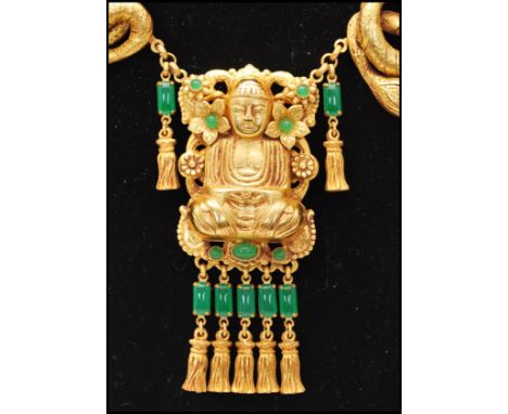A vintage signed Askew of London gold-tone statement figural necklace with central Buddha. Necklace measures 20 inches,&nbsp;
