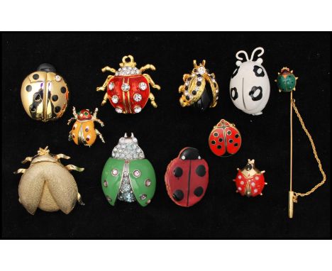 A collection of vintage Ladybird bug brooch pins to including rhinestone set, enamel, terracotta, decorated styles. x 11 Larg