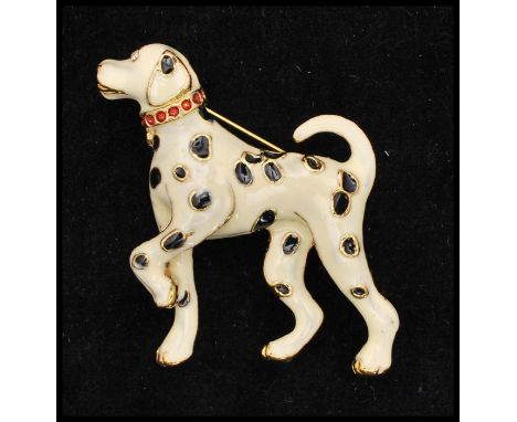 A vintage gold-tone enamel figural brooch in the form of a Dalmatian dog. Measures approx 1 1/2 inches.