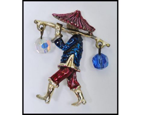 A signed Corocraft Chinese water carrier brooch decorated with enamel having AB glass bead dangles. Measures 2 inches.