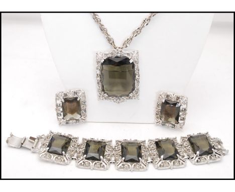 A 1960s signed vintage Sarah Coventry, Celebrity, 1962, silver-tone smokey quartz glass demi parure pendant necklace, bracele