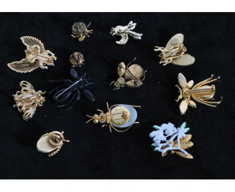 A collection of 12 vintage bug brooches to include signed Monet gold-tone Bee, Regency red rhinestone bug, Gerries wasp, AB R