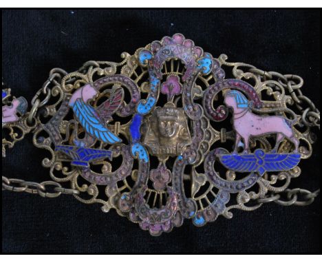 A 1920s Czech Neiger brothers Egyptian revival filigree and enamel belt decorated with enamelled Egyptian figures having a cl