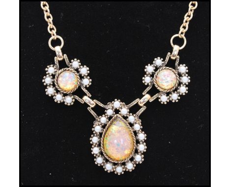 A signed 1970s Sarah Coventry Empress Victorian style necklace being set with faux opal and pearl. Measures approx 17 inches 