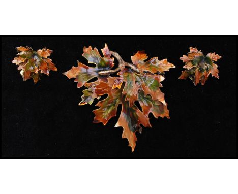 A vintage signed Weiss gold-tone figural enamel decorated Maple leaf brooch and earring set. Brooch measures 3 inches.