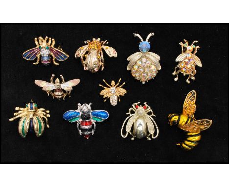 A collection of vintage bug brooches having enamel, rhinestone, ab rhinestone decorated styles, to include a signed Roman &co