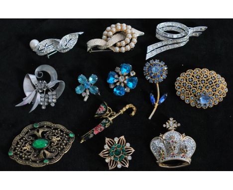 A collection of vintage brooch pins to include signed silver-tone Krasne of California, signed Boucher with baguette and roun