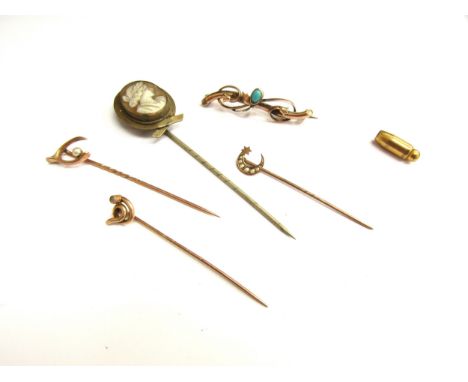 Four stick pins including 9ct gold examples, a cameo stick pin and a gold bar brooch stamped 9ct, 4.5g gold 