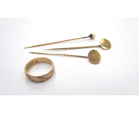A 9ct gold band, size M/N, two 9ct gold stick pins and another, 6g marked gold 
