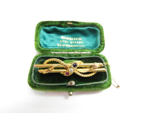 A gold bar brooch with rope detail, centre set with ruby, diamond and sapphire, marks rubbed, 4.2g 