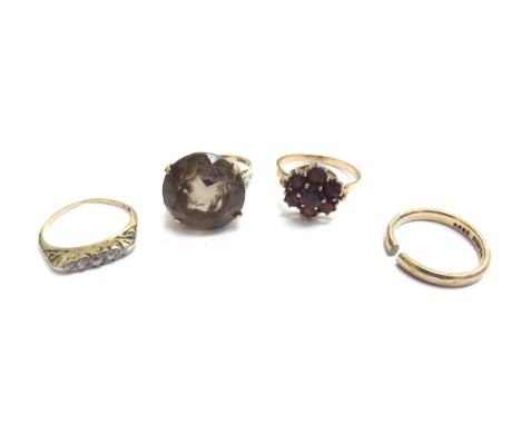 Four gold rings including three 9ct examples, smoky quartz size M, wedding band (cut), garnet cluster size Q, five stone diam