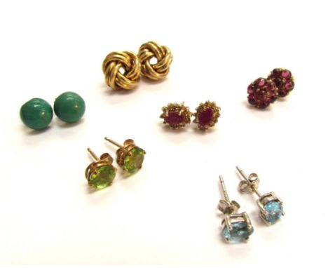 Six pairs of stud earrings including ruby, turquoise, peridot, topaz and Knot examples 
