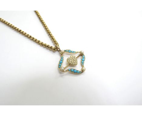 A turquoise and seed pearl open pendant with a central heart motif, stamped 15ct hung on a gold chain stamped 10, 44cm long, 