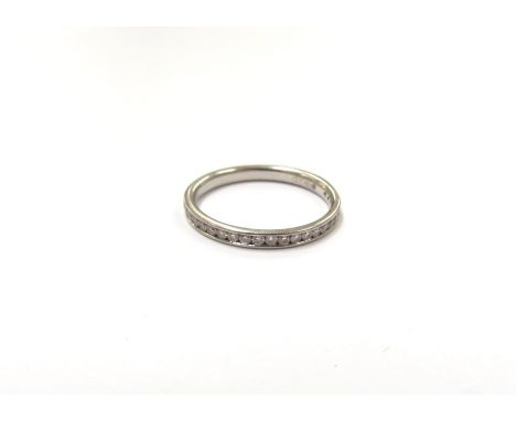 A platinum diamond set band. Size K/L, 2.2g 