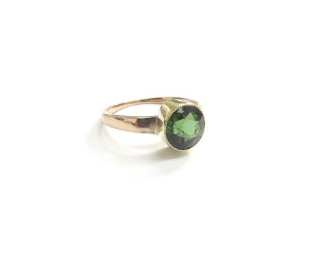 A gold ring set with a round green tourmaline, unmarked. Size K, 2.5g 