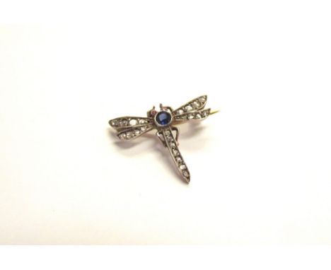 A dragonfly brooch with ruby eyes, sapphire thorax and old cut diamond abdomen and wings, unmarked, 2.8cm wide, 2g 