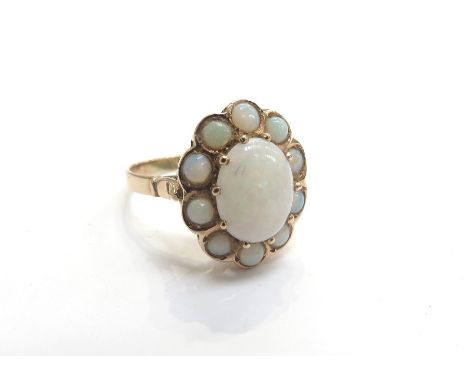 A Circa 1930's gold opal cluster ring, unmarked. Size N, 2.5g 