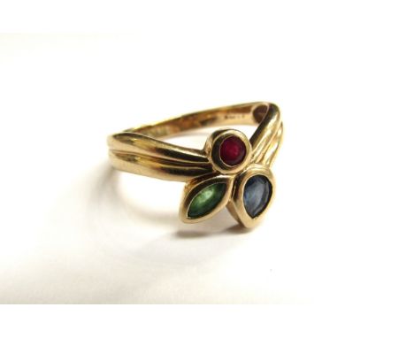 A 9ct gold ring set with a ruby, sapphire and emerald in rubover settings. Size Q/R, 3.6g 