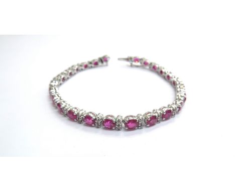 A ruby and old cut diamond bracelet, unmarked metal, 18cm long 