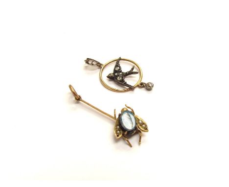 A circular pendant with diamond studded swallow to centre and old cut diamond drop, unmarked with a bar pendant with an opal 