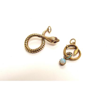 A 9ct gold coiled snake pendant, with ruby set eyes and another of a coiled snake with a turquoise and seed pearl horseshoe a