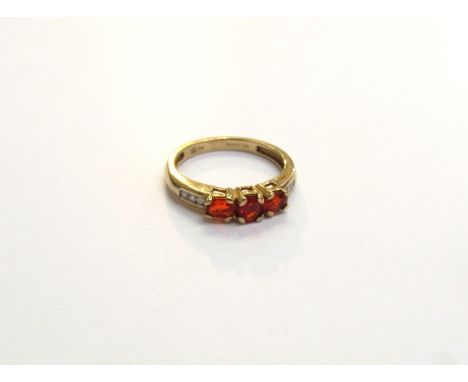 A 9ct gold fire opal and diamond ring. Size J, 1.7g 