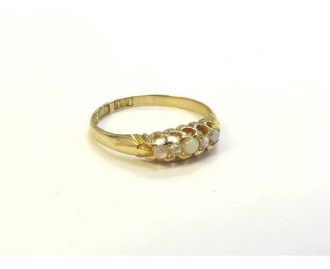An 18ct gold five stone opal and diamond ring, 1897. Size O, 2.2g 