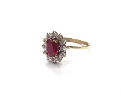 A 9ct gold ruby and illusion set diamond cluster ring. Size P, 2.3g 