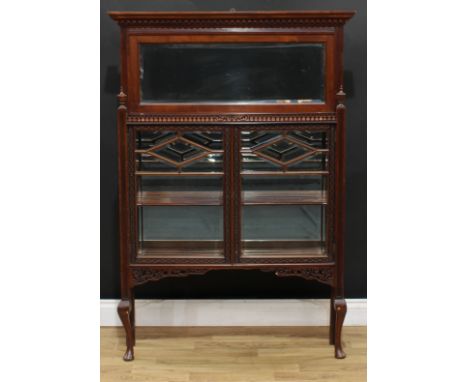 A 'Chippendale Revival' mahogany composed pier bookcase, moulded cornice with dentil capital above a bevelled rectangular mir