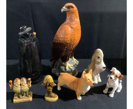 A Royal Doulton model of a Puppy with a chop, HN1159;  a Sylvac Corgi;  a Wade Guinness advertising model, Tweedle Dum and De