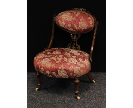 A Victorian mahogany boudoir chair, oval cresting rail carved and applied with scrolling acanthus, shaped and pierced splat, 
