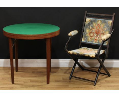 A late 19th century ebonised campaign type steamer chair, 87cm high, 53.5cm wide, the seat 36cm wide and 36cm deep; a folding