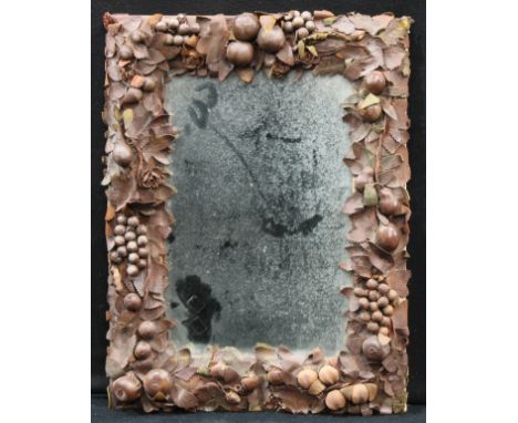 Interior Design - an interesting wall mirror, the frame modelled in brown leather with ripe fruit and leafy stems, in bold re