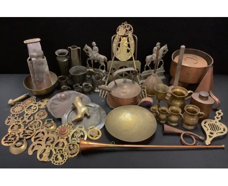 An 18th century pewter plate;  pewter mugs;  Lord Roberts cast door stops;  trivet;  horse brasses;  copper kettle;  copper h