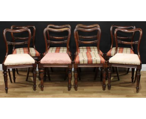 A set of eight William IV rosewood dining chairs, drop-in seats, lotus capped tapered cylindrical forelegs, arrow forefeet, 8