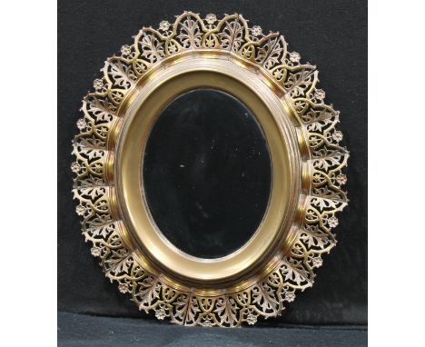 Interior Design - an oval wall mirror, the frame consisting of removalble coronet shaped pierced brass panels, hanging loop, 