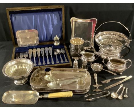 An EPNS three piece boat shaped bachelor's tea service; an oak canteen of EP fish knives and forks; other silver plated items