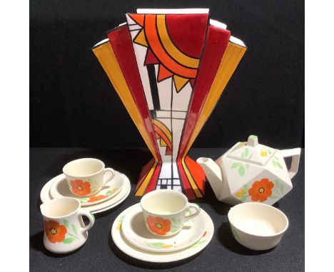 A Staffordshire Brian Wood Art Deco style geometric vase, painted in bright enamels in shades of red, ochre and orange with a