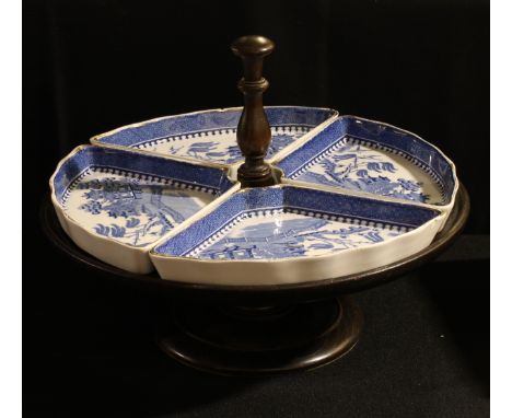 A set of Minton table centre hors d'ouvres dishes, retailed by Waring &amp; Gillow, London, on an oak lazy Susan, early 20th 