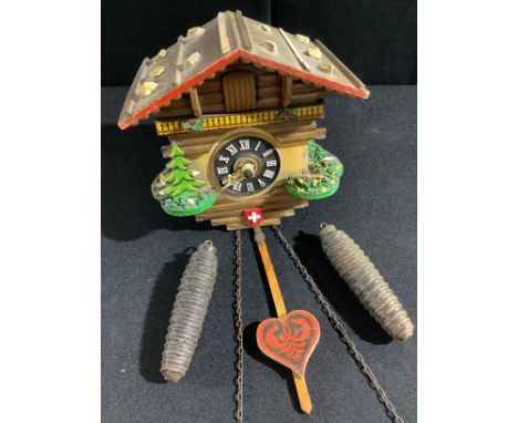 A Swiss chalet novelty cuckoo clock, Loetscher style with pinecone counter weights 