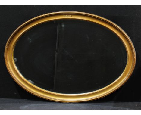 An oak framed over mantel mirror, carved with central zephyr mask and scrolls, 92cm x 47cm; other similar early 20th century 