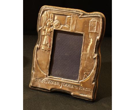 An Elizabeth II silver novelty easel photograph frame, East West, Home's Best, 15.5cm high, London 1983 