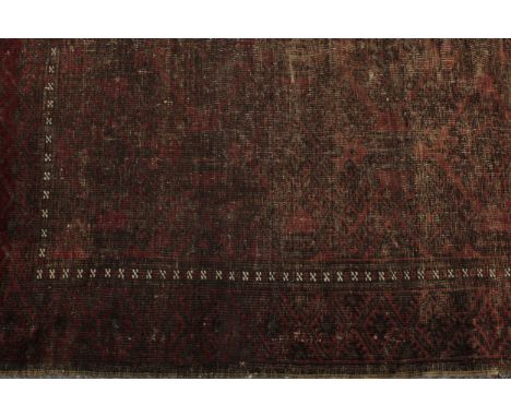 A 19th century Vauxhall type walnut mirror, 51cm high; a woollen rug, in tones of red, 190cm x 122cm 