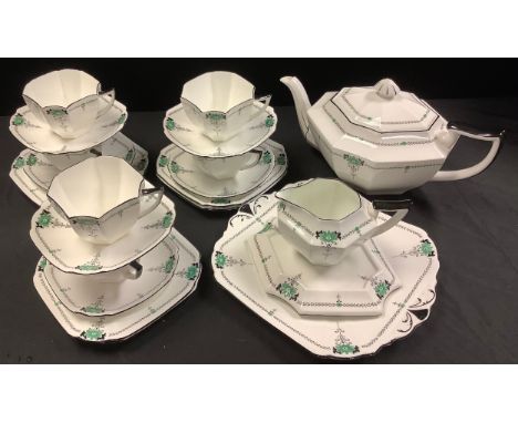 A Shelley Queen Anne Daisy pattern tea service, for six, comprising teapot, cover and stand, milk jug, cups, saucers, side pl