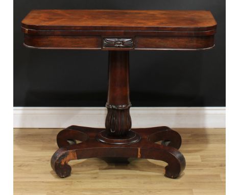 A William IV rosewood card table, hinged top enclosing a baize lined playing surface, lotus grasped spreading cylindrical pil