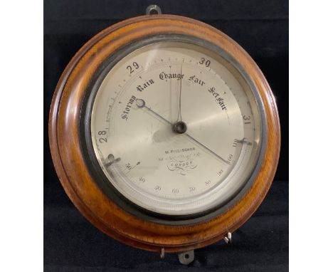 A late 19th century barometer, silvered dial, M  Pillischer, London, oak mount, 30cm diam 