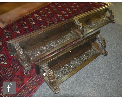 A Victorian carved oak shelf supported by three stylized ship's figure head characters, length 170cm, a similar smaller shelf