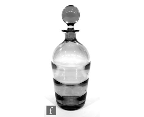 A 1940s crystal glass decanter designed by Elis Bergh for Kosta of tapering ribbed optic form below the ball stopper, engrave